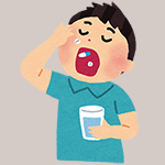 薬を飲む男性